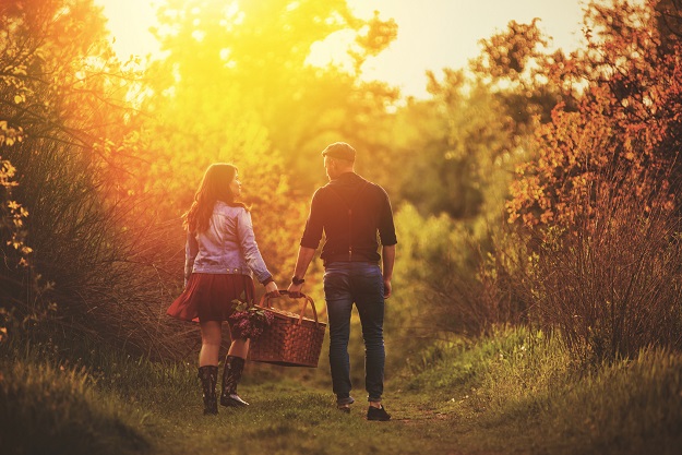 Couple with picnic basket outdoors. couple with picnic basket. Valentine's Day